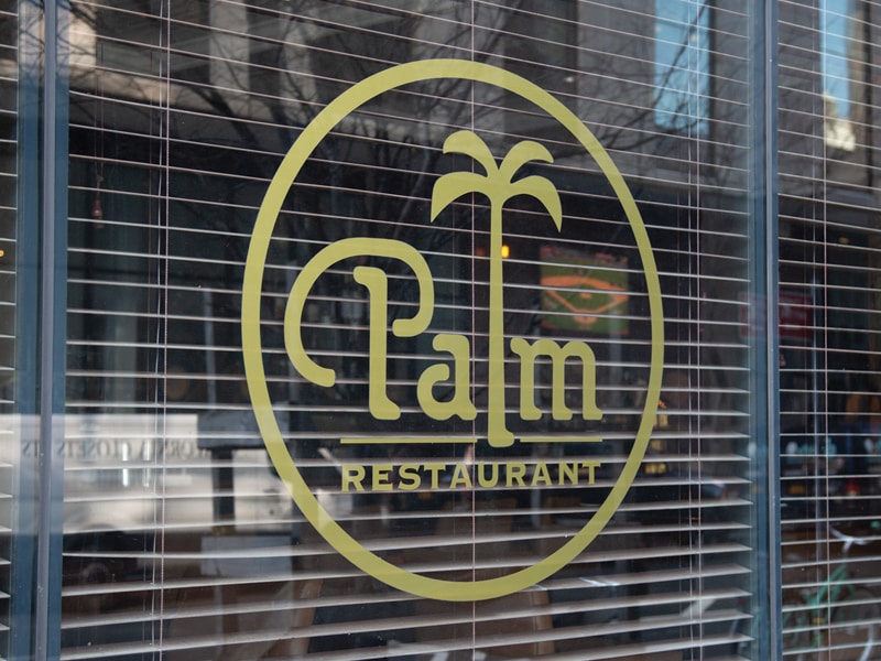 Gold Window Decal With the 'Palm Restaurant' Logo